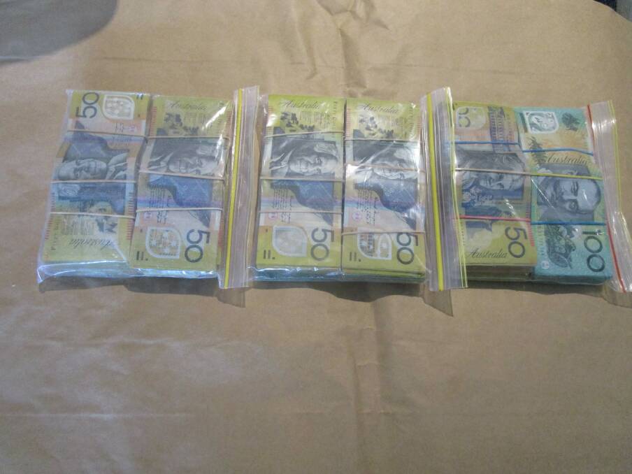 Cash seized from a Canberra home. Photo: ACT Policing