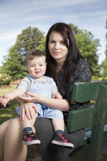 Louise Frame with son Ryan, 16 months, in the rose garden near Old Parliament House. Ms Frame accessed help from a Canberra post-natal depression support group as she struggled following Ryan's birth. Photo: Matt Bedford.
