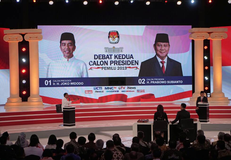 Indonesian President Joko Widodo, left, gestures towards his opponent, Prabowo Subianto, during a second presidential debate in Jakarta on Sunday. Photo: Bloomberg