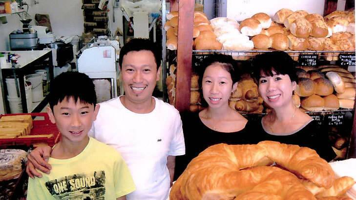 Local identities: Quan and Trinh Nguyen with their children Sophie and Kevin at the Vina Bakehouse in Wanniassa. Photo: Megan Doherty