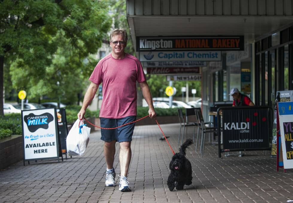 Graham Coddington of Kingston with his spoodle Toby. He agrees Canberra is a dog-friendly city. Photo: Elesa Kurtz
