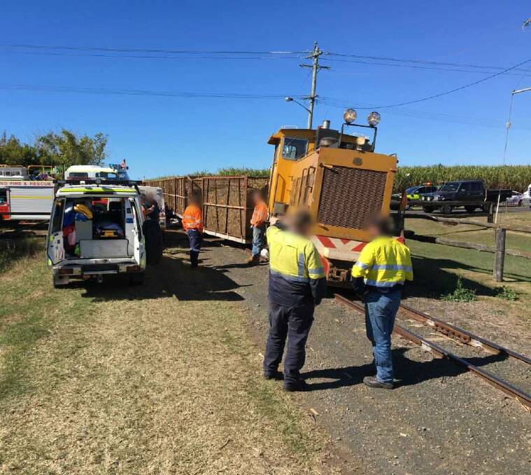 The cane train derailed after the impact with the car. Photo: RACQ Lifeflight Rescue
