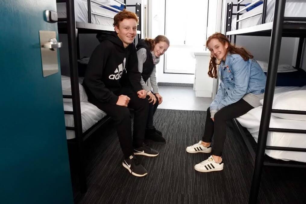 Tom, Bella and Jess Collishaw in one of the rooms at new group accommodation centre Canberra Park, next to Exhibition Park. Photo: Katie Burgess
