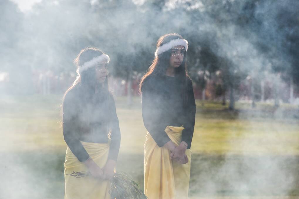 Bella and Bo House at a smoking ceremony to mark Reconciliation Day in Canberra on Monday morning. Photo: Karleen Minney