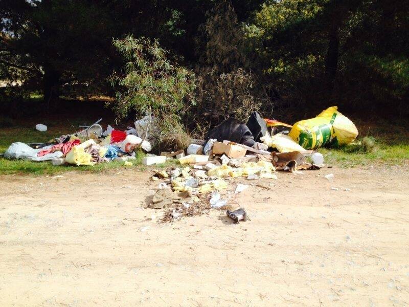 Spent firearm cartridges were found in this rubbish dumped outside Lark Hill Winery. Photo: Supplied