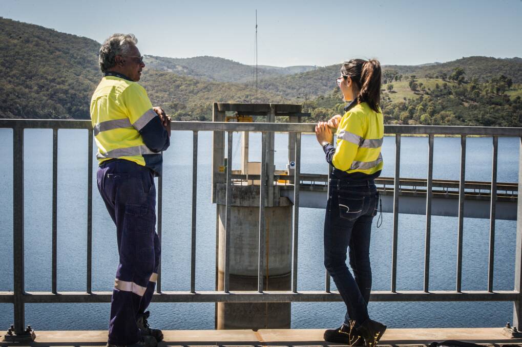 Icon Water water industry operator Siva Preeyadarshanan and operations process engineer Alice Liao check levels in the Googong Dam last Wednesday. Photo: Karleen Minney