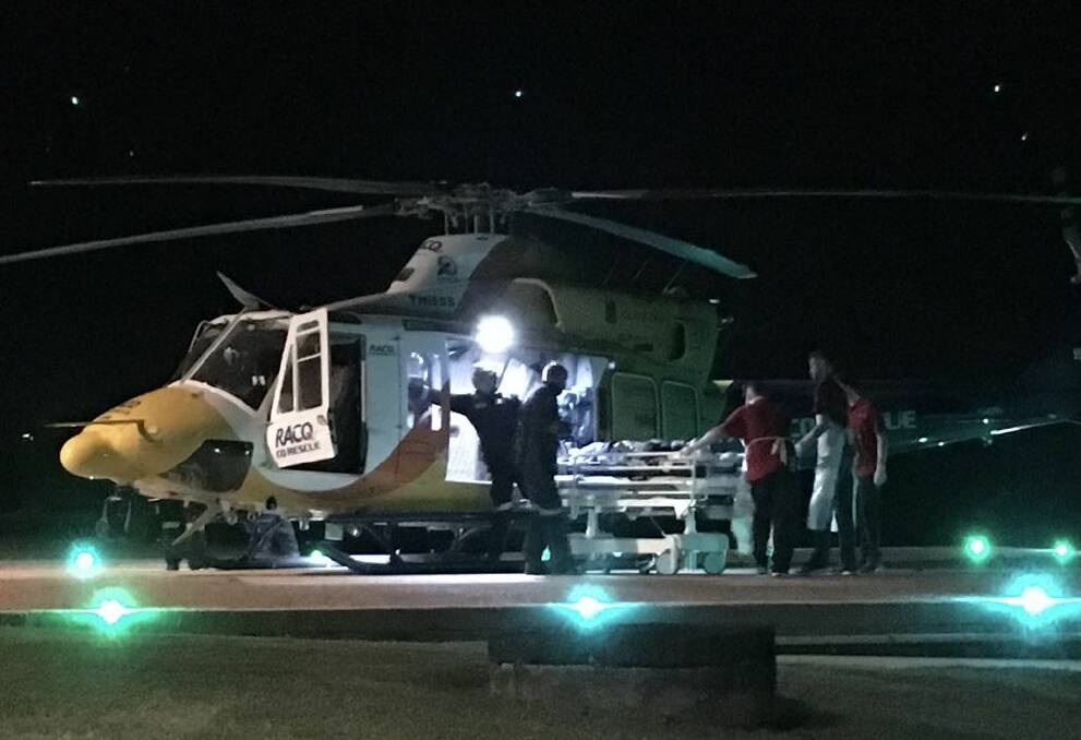 The RACQ CQ Rescue helicopter lands at Mackay Base Hospital with the shark attack victim. Photo: Olivia Grace-Curran - Nine News Queensland