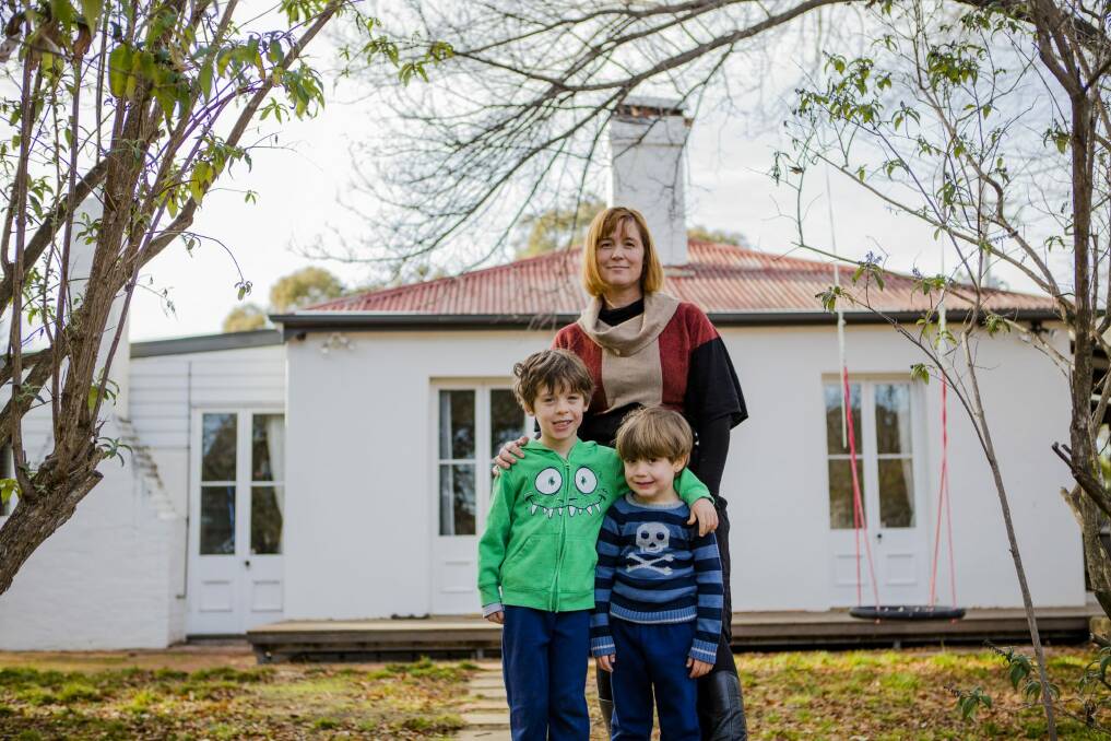 Kate Gauthier is concerned about heritage being destroyed at Oaks Estate. She stands with her two sons Atticus 5, and Luther 4.
The Canberra Times
 Photo: jamila_toderas