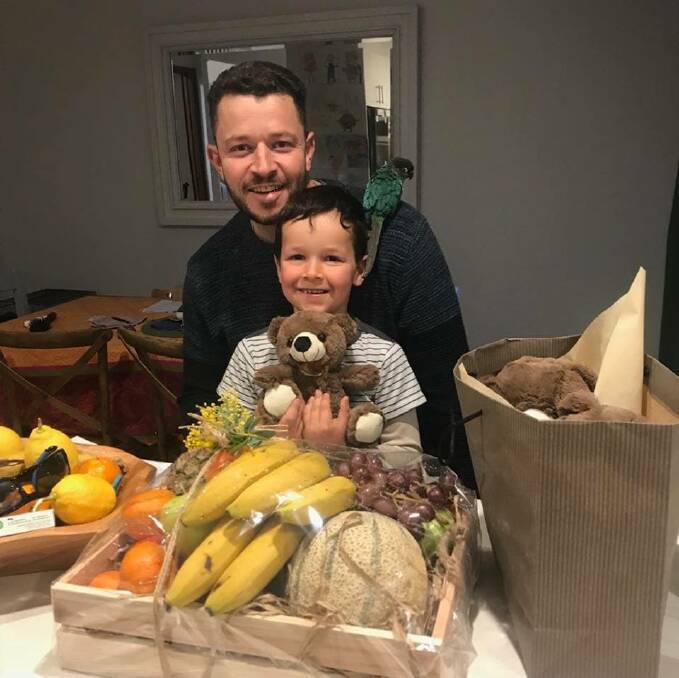 Phoenix Mapham with his father Cliff Mapham and their bird Green Bean on Friday. Father and son were reunited on Thursday night, Photo: Supplied