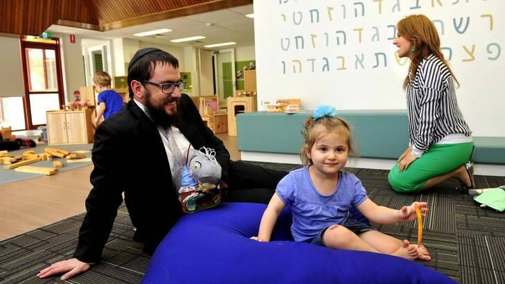 Rabbi Shmueli Feldman with his daughter Chaya Mushka Feldman, 3. Photo: Melissa Adams