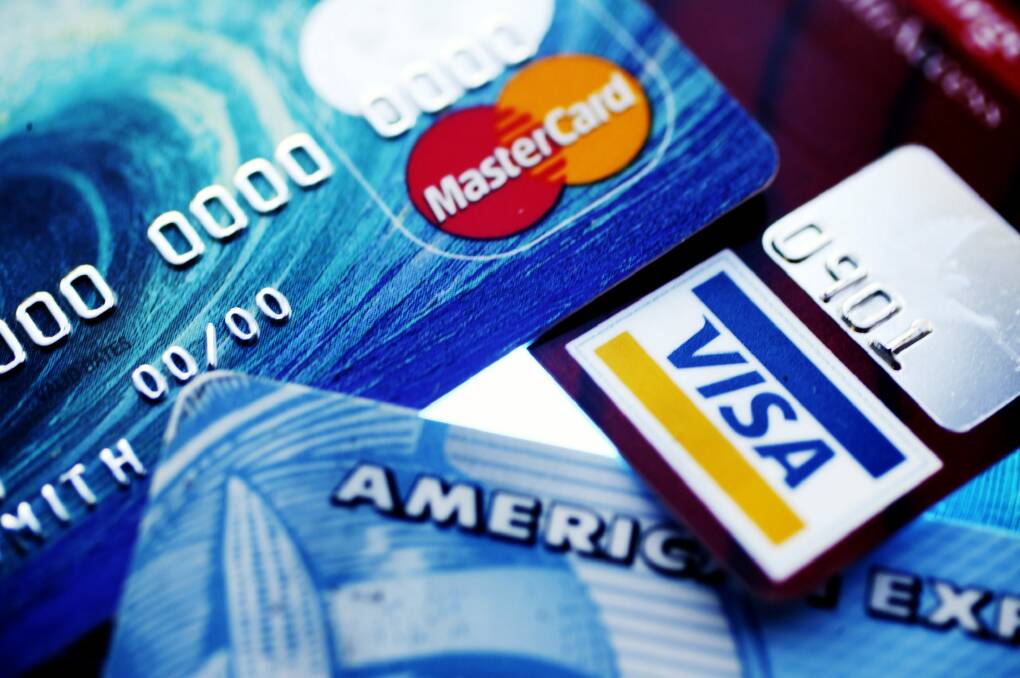 Public servants using work credit cards for personal spending have added to departmental bills. Photo: Louie Douvis