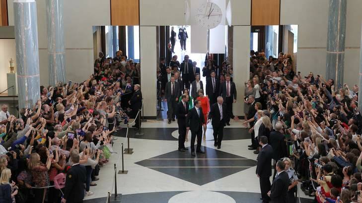 Phone cameras at the ready: The marble foyer at Parliament House was full of people hoping to catch a glimpse of the royal couple. Photo: Alex Ellinghausen