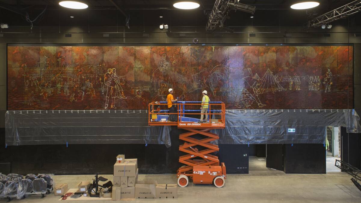 Staff from Abode Restoration and International Conservation Service install Sidney Nolan's <i>Eureka Stockade</i> in the Cultural Centre in ANU's new Kambri precinct.  Photo: Lannon Harley/ANU