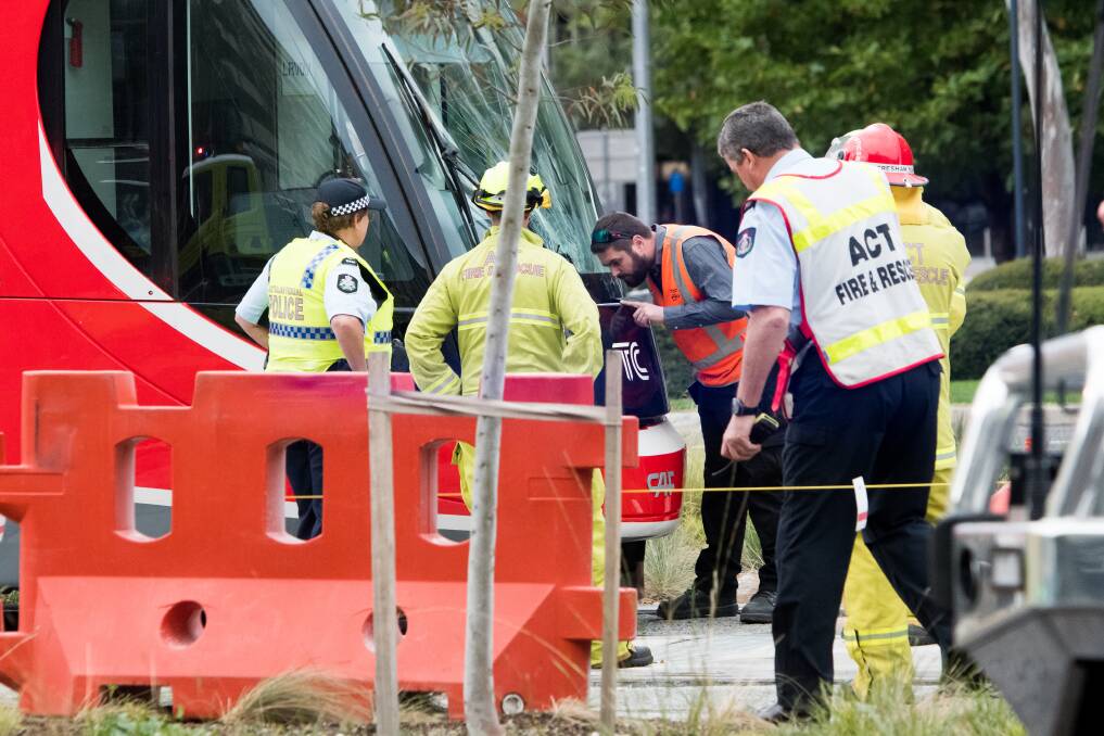 Emergency services at the scene of a collision between a tram and a pedestrian in Canberra on Saturday morning. Photo: Elesa Kurtz