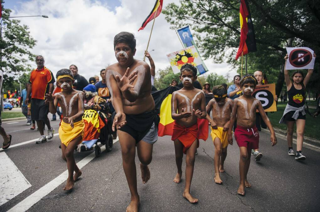 Indigenous Australians lead a march to the Aboriginal Tent Embassy in Canberra. Photo: Rohan Thomson
