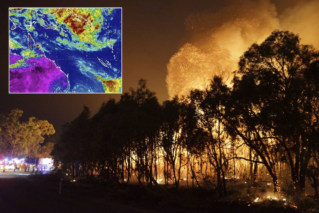 Fire crews confronted by massive flames at Deepwater in central Queensland. The weather bureau is also watching a potential tropical cyclone near the Solomon Islands. Photo: Rob Griffith/Costi Farms/AP &amp;amp; BoM
