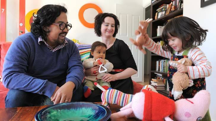 ABC radio journalist, Ginger Gorman, at her home in Watson, with partner Don Gomez and their children Kitty Gomez, 7 months and Elsa, 3 years. Photo: Graham Tidy