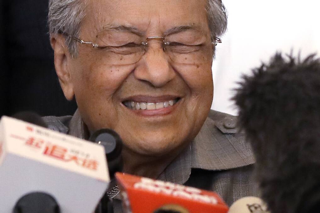 Mahathir Mohamad tells the media he has a clear mandate to form a new government in Malaysia. Photo: AP