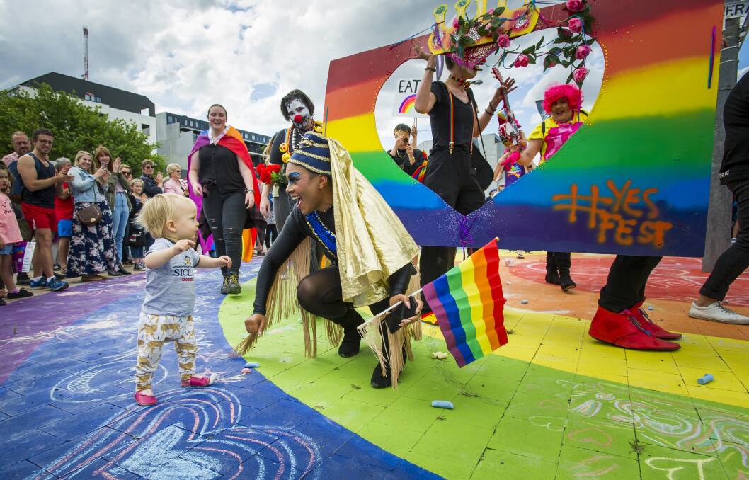 Leo Santangelo Hall, 15 months, of Hackett getting involved and dancing during the circle of love parade with Sheba Williams. Photo: Elesa Kurtz