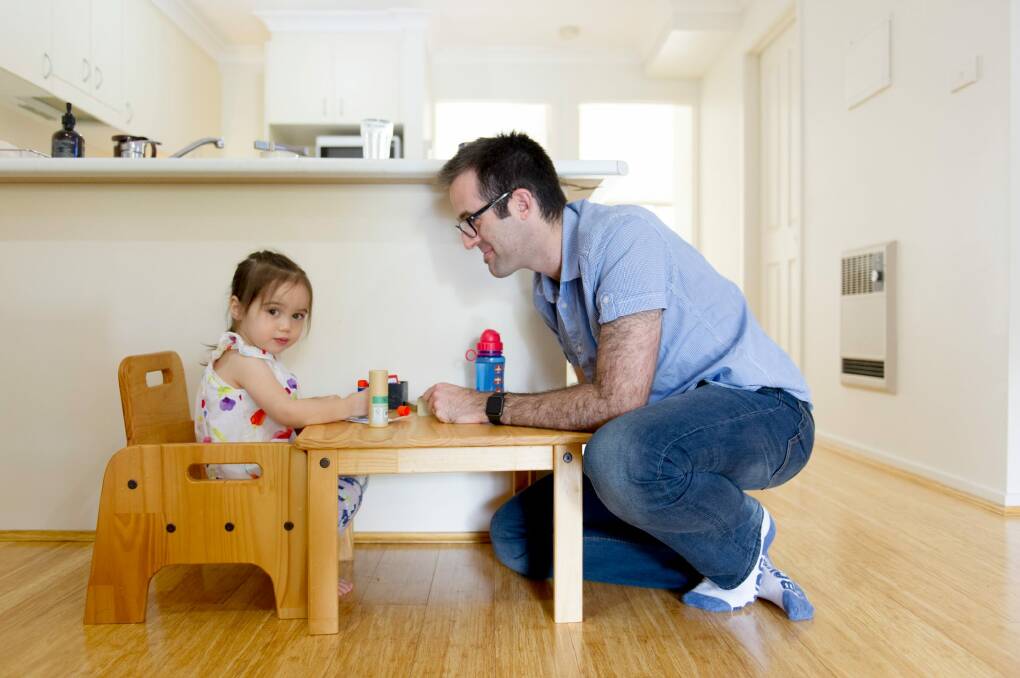 Icelab director and developer Tim Riley at home with daughter Clover, two. He works a four-day week and also works from home two days a week. Photo: Jay Cronan