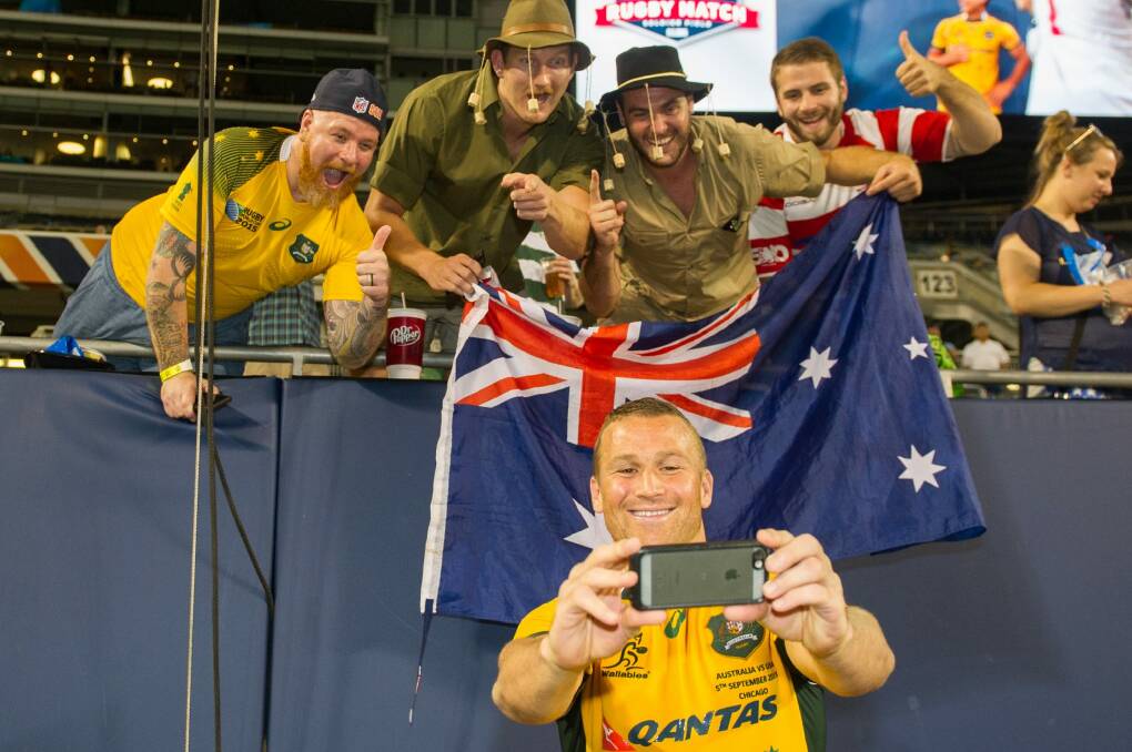 Snap happy: Matt Giteau poses for a fan selfie in the US before the World Cup. Photo: Stuart Walmsley