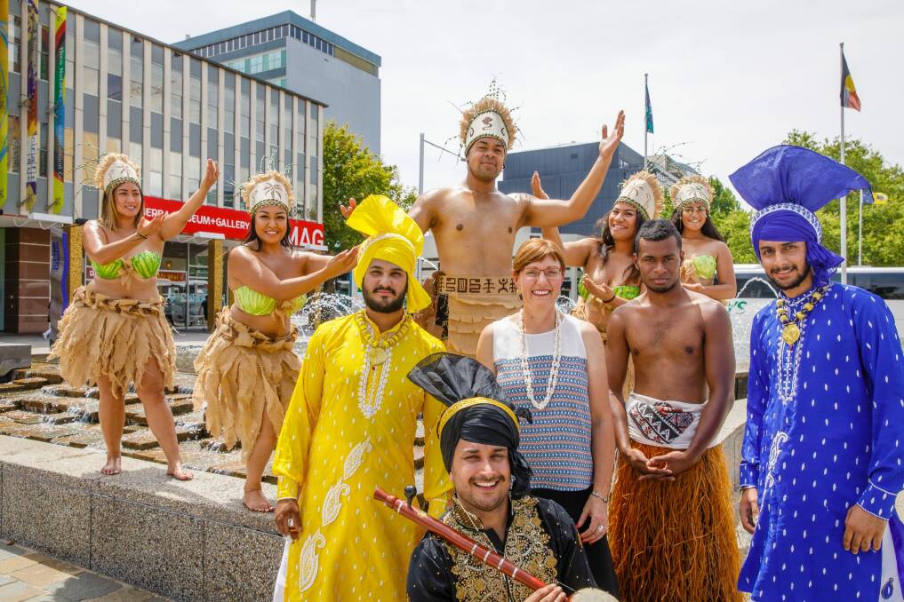 Members of United Nesian Movement and Varis Punjab De dance groups help multicultural affairs minister Rachel Stephen-Smith launch the National Multicultural Festival on Friday. Photo: Sitthixay Ditthavong