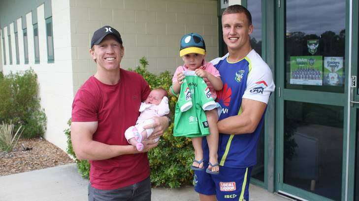 Former Canberra Raiders skipper Alan Tongue, with daughter, Lola. Raiders player Jack Wighton is holding Tongue's son, Gem.