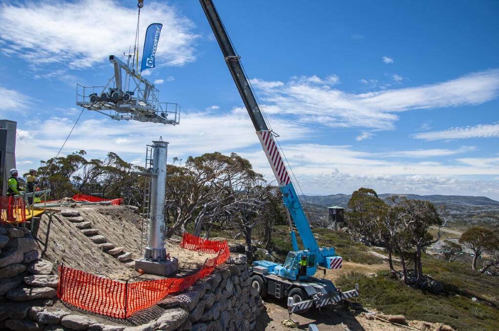 One of the new ski lift towers at Perisher being installed by crane. Photo: Supplied