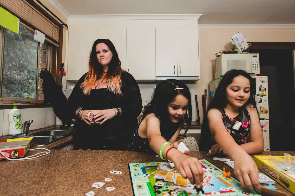 A recent ANU study says overly demanding jobs puts the mental health of employees' kids at risk. Bronwyn Dunn with her daughters Maleeha 7, and Amaiya 11.  Photo: Jamila Toderas
