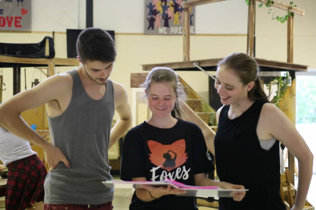 Foxes director Rachel Pengilly, centre, shares notes with actors Tanner Clark, left and Katherine Berry on the set. Photo: Supplied