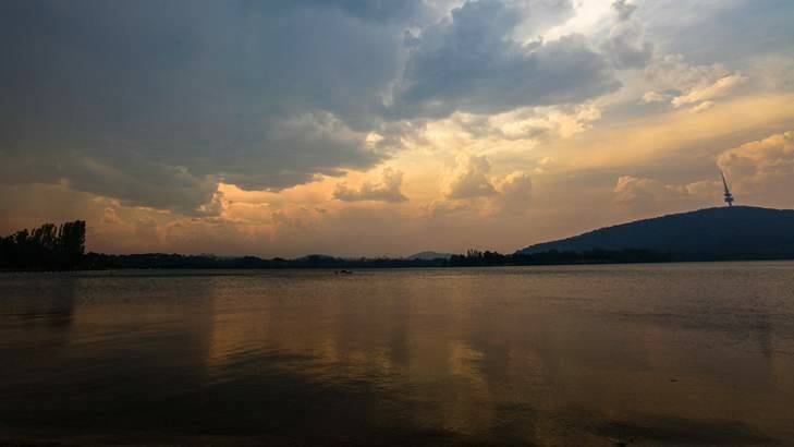 Bush smoke and storm clouds over Canberra. Photo: Katherine Griffiths