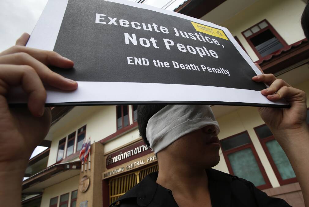 Amnesty International activists protest against the death penalty outside Thailand's Bang Kwan Central Prison. Photo: AP