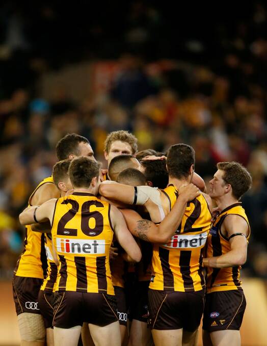 The Hawks celebrate on the final siren. Photo: AFL Media/Getty Images