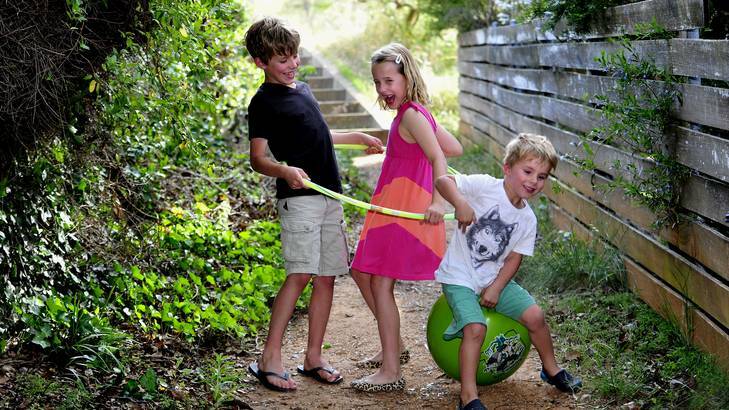 Mac Stephen, 8,  playing with his sister  Emily, 7, and brother Will, 4. Photo: Melissa Adams