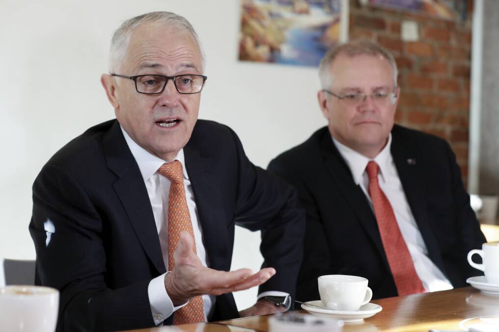 <p>Prime Minister Malcolm Turnbull  and Treasurer Scott Morrison meet with members of the community to discuss the aged care package during a visit to a cafe in Queanbeyan, on Thursday May 10, 2018.</p>
 Photo: Alex Ellinghausen