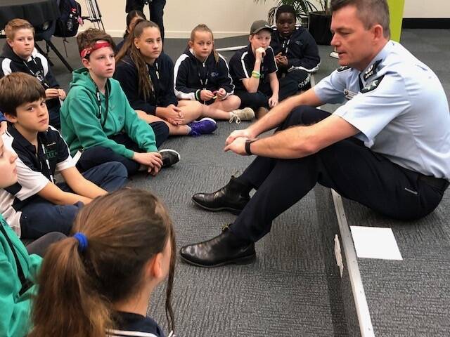AFP Commissioner Andrew Colvin talks to Canberra children on Friday, International Missing Children's Day. Photo: Supplied