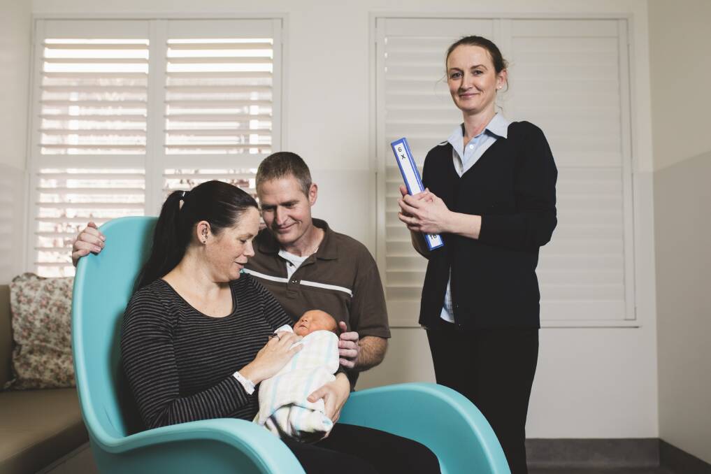 Queanbeyan couple Emma Weston and Mick Campbell with their newborn son William in one of the new single rooms in  the revamped maternity ward at Calvary Public Hospital. With them is midwife Helen Stephenson. Photo: Jamila Toderas