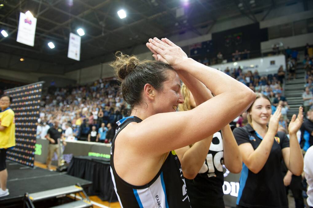 Kelsey Griffin is overcome by emotion after the Canberra Capitals won the WNBL championship. Photo: Sitthixay Ditthavong