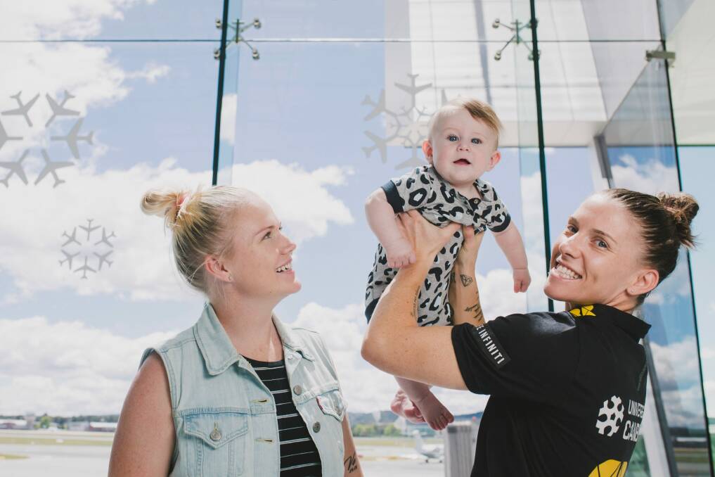 Canberra Capitals captain Nat Hurst with her wife Tara and their son Nash 6-months-old.  Photo: Jamila Toderas
