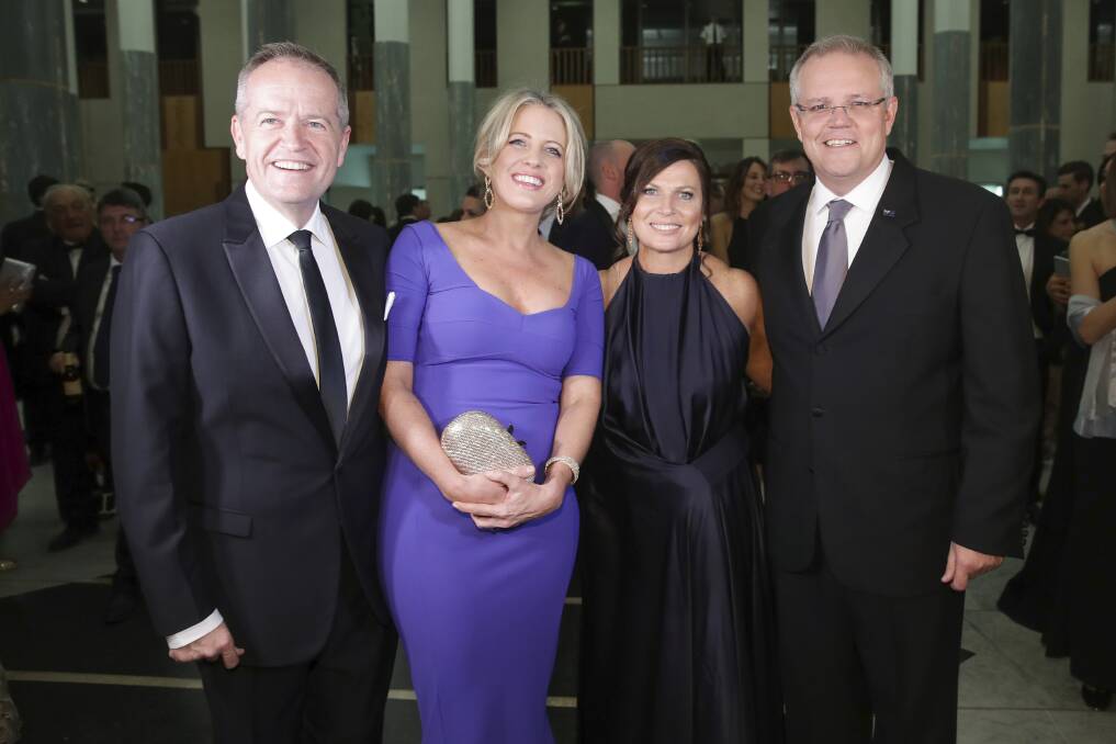 Opposition Leader Bill Shorten and Chloe Shorten with Prime Minister Scott Morrison and Jenny Morrison as they arrive for the Mid Winter Ball at Parliament House in Canberra Wednesday night. Photo: Alex Ellinghausen