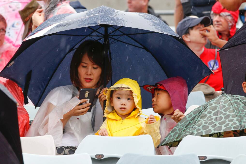 Rain did not dampen the spirit of an enthusiastic crowd during last month's Asian Cup.

Canberra Times photo by Matt Bedford Photo: Matt Bedford