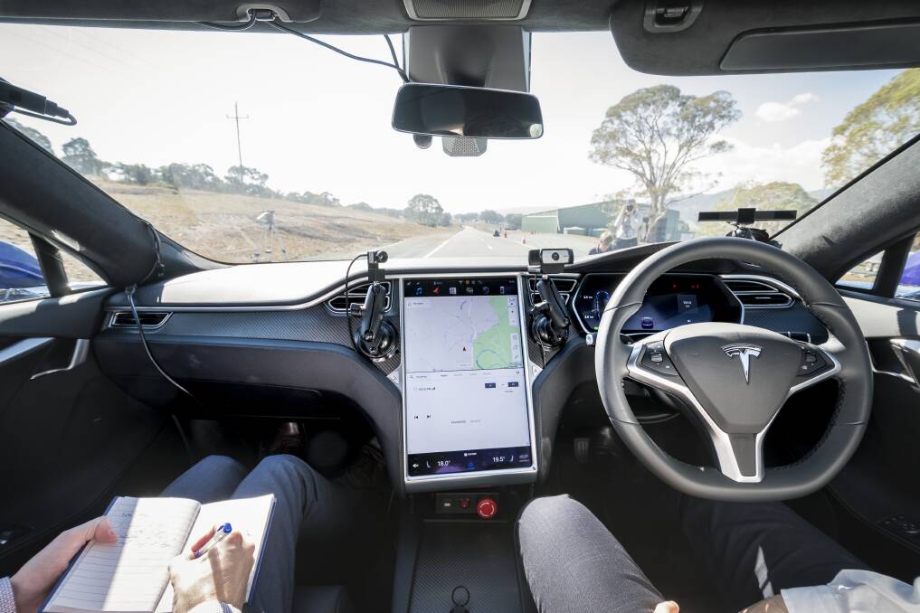 The view from behind the wheel of a Tesla vehicle fitted with Seeing Machines' driver monitoring technology. Photo: Sitthixay Ditthavong