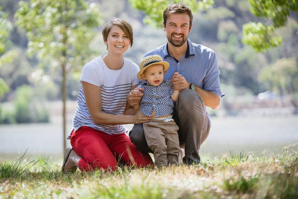 Belconnen couple Rebecca Stones and Adam Duffy with their 14-month-old son Henry. The couple are engaged but will not marry until same sex marriage is legalised.  Photo: Sitthixay Ditthavong