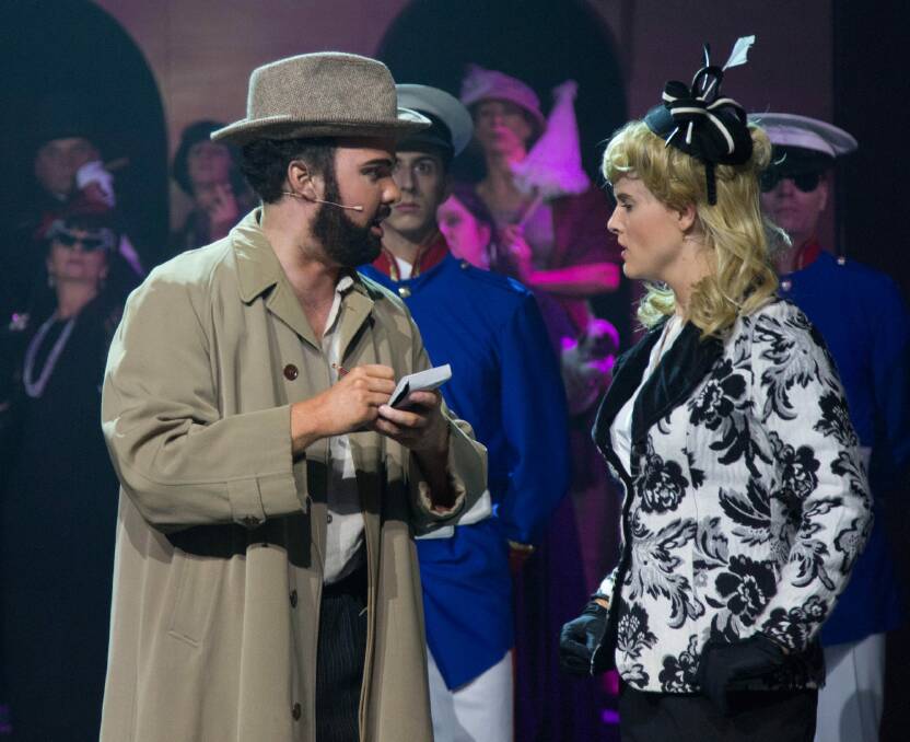 Grant Pegg as Che the interviewer and Kelly Roberts as Eva Peron in Canberra Philharmonic's production of Evita.  Photo: Donna Larkin