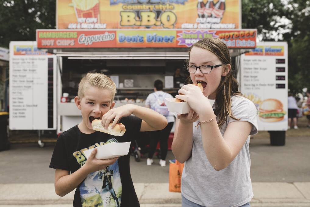 Prefer traditional show fare? Riley and Jessica Element enjoy a hotdog at last year's show. Photo: Jamila Toderas