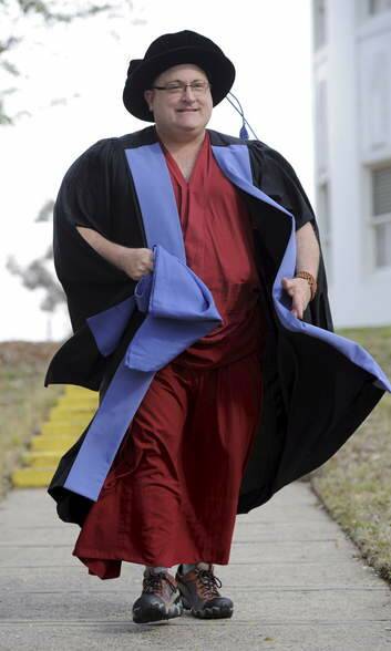 Associate Professor and Buddhist monk Alex Bruce received a PhD in Law on Wednesday. Photo: Graham Tidy