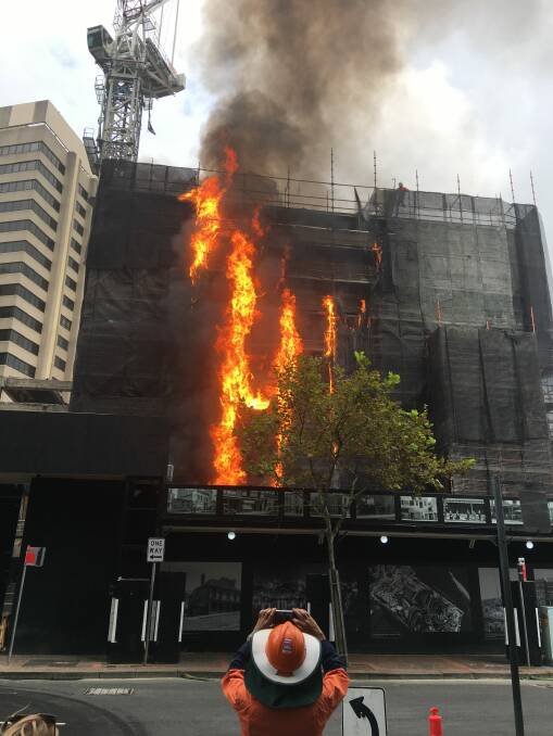 More than 60 firefighters battled the blaze at the building site in Circular Quay. Photo: Hugh Fraser