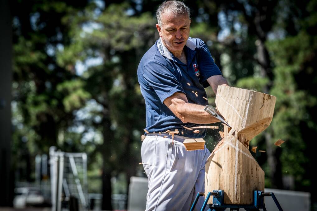 Andrew Wiseman, the show's woodchopping sector head, demonstrating the skill. Photo: Karleen Minney