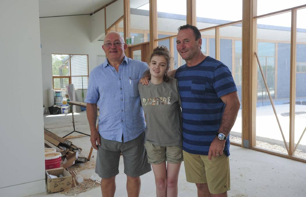 Ricky Stuart, with Emma and foundation director John Mackay, left. His dream for a respite home was made possible through the generosity of sponsors, project managers and architects.  Photo: Graham Tidy