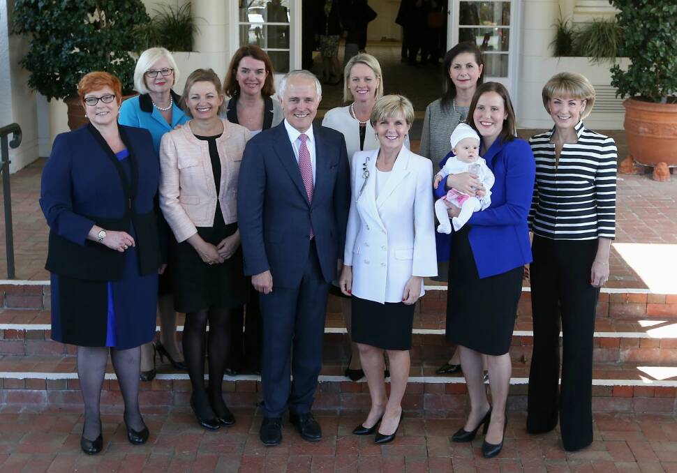 Mr Turnbull with the women in his new ministry including five women in cabinet. Photo: Alex Ellinghausen